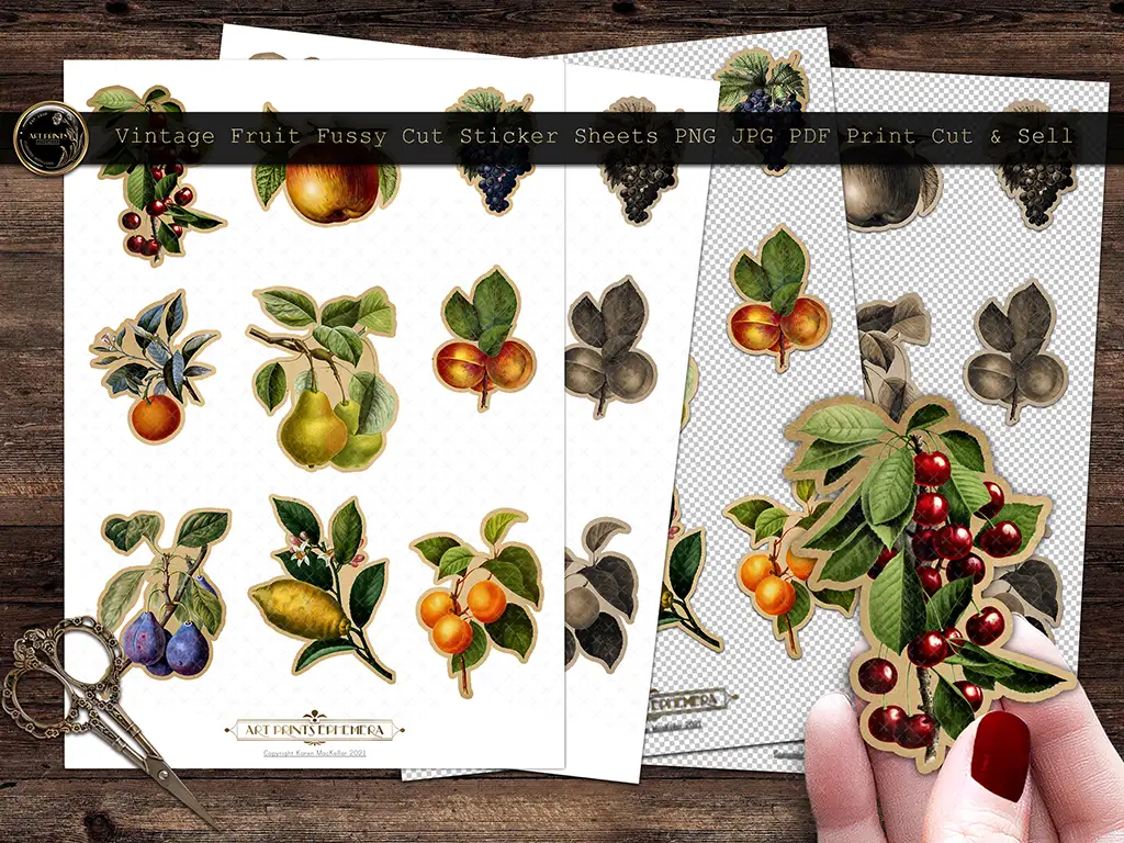 Three sheets of vintage fruit-themed stickers lie on a wooden surface, showcasing illustrations of cherries, apples, pears, and more. A hand with scissors holds a cut-out sticker of red berries. The sheets are labeled for printing and cutting.