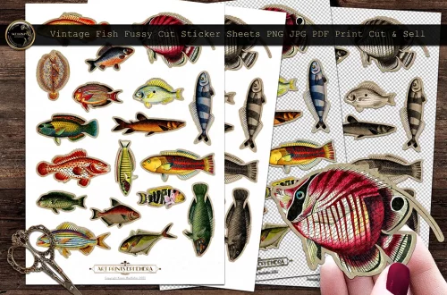 A collection of vintage fish fussy cut sticker sheets is shown, featuring various colorful fish designs. The sheets are displayed on a wooden surface with a pair of scissors nearby. One hand is holding a cut-out fish sticker in the foreground.