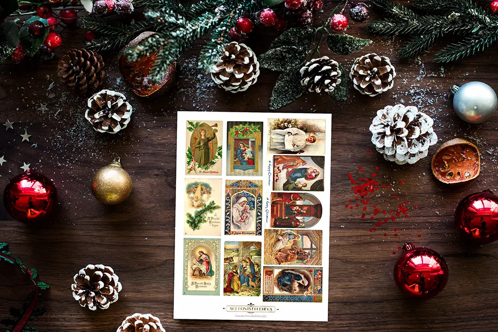 A festive Christmas scene featuring a variety of vintage holiday postcards surrounded by pinecones, fir branches, and red, gold, and silver ornaments. The wooden background is lightly dusted with snow, adding to the seasonal atmosphere.