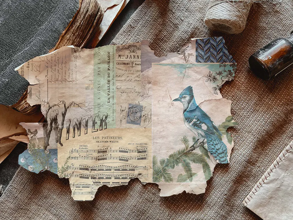 A torn, vintage-style collage features a blue jay perched on a pine branch, musical notes, and various handwritten texts. The word "WINTER" is prominently displayed in bold letters. Surrounding the collage are aged papers, a spool of twine, and an old bottle.