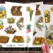 A collection of vintage Easter-themed cutouts featuring bunnies, chicks, eggs, and baskets filled with flowers. A person holds an oval cutout with two rabbits in a field. The designs are spread across two sheets.