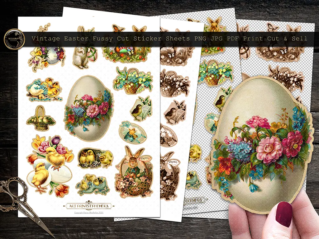 A hand holding a vintage Easter egg sticker adorned with flowers. In the background, three sheets of vintage Easter-themed stickers are visible, featuring bunnies, chicks, and floral designs. Scissors are placed on the wooden surface.